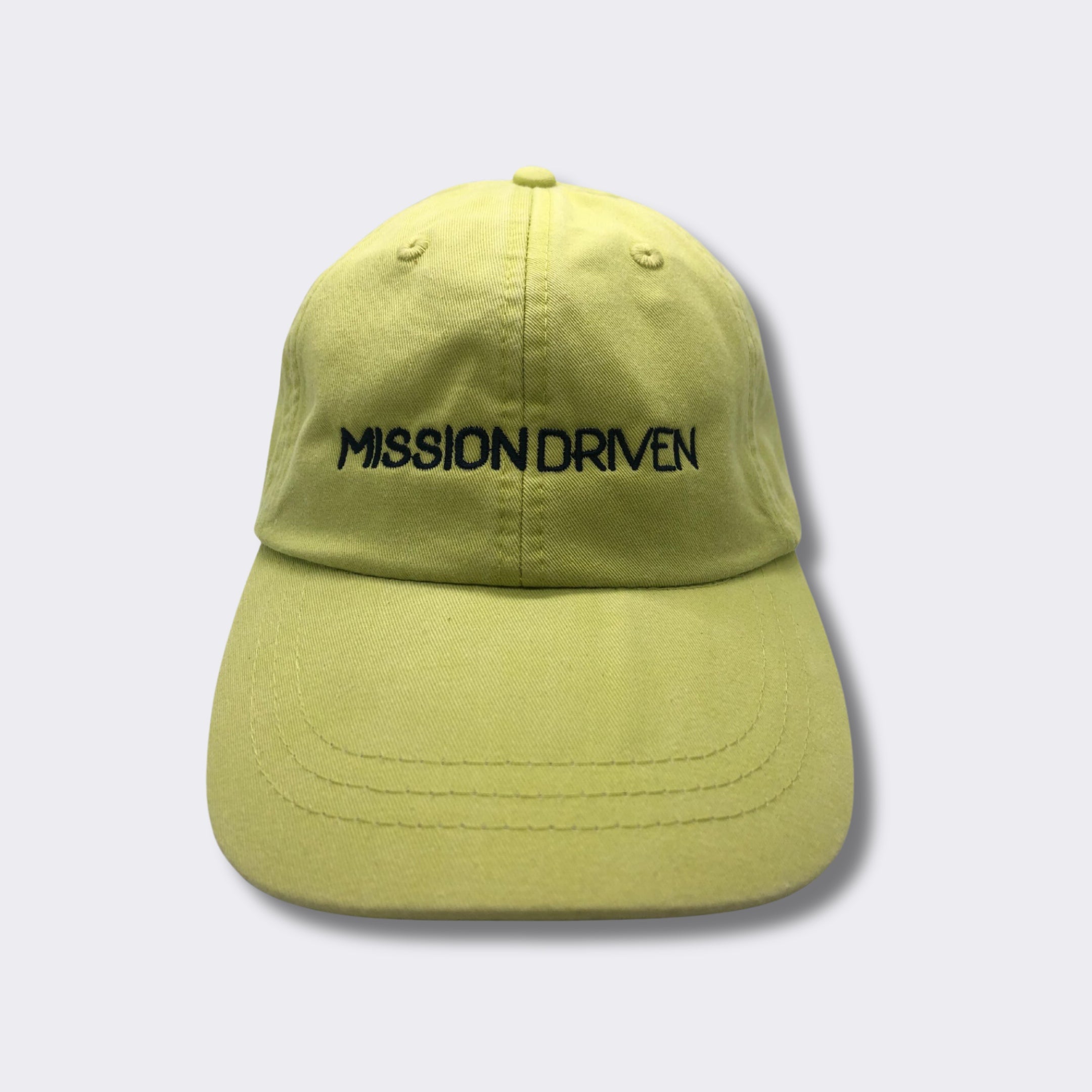 https://missiondrivengoods.com/cdn/shop/files/MissionDrivenBaseballHat-NeonGreen-MissionDriven_2160x.jpg?v=1694119543